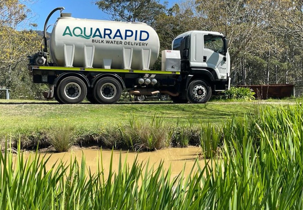 AquaRapid Bulk Water Delivery truck refilling a livestock dam reservoir